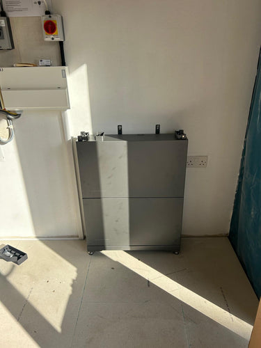 EcoFlow 5kW hybrid battery unit partially installed.